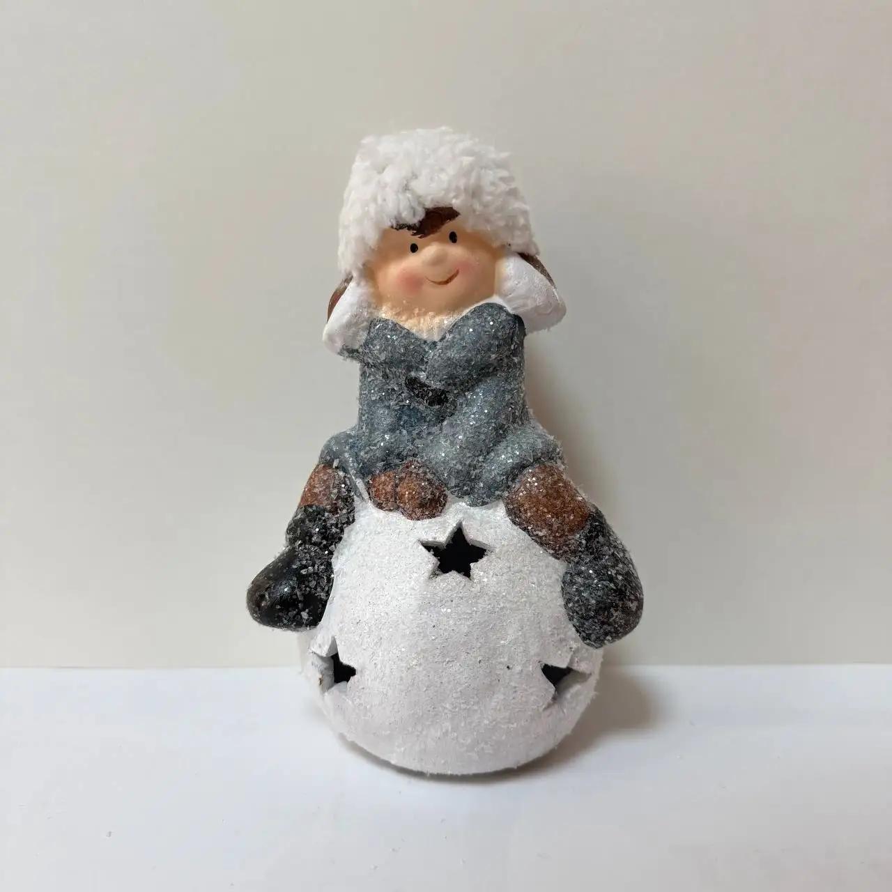 New Year's figurine with backlighting ‘Boy on a snowball’