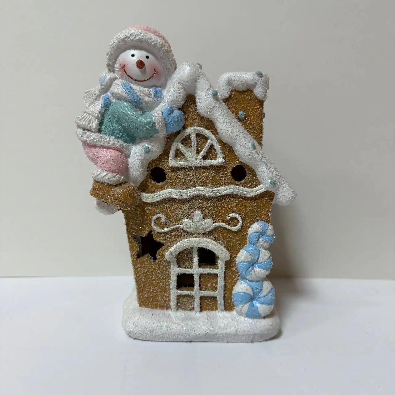 New Year's figurine with backlighting ‘Snowman with a gingerbread house’